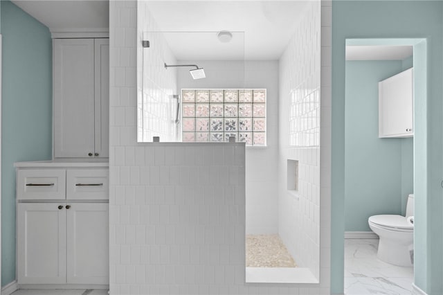 15822 Portillo Dr, Corpus Christi, TX 78418 - bathroom featuring marble look tiles and walk in shower
