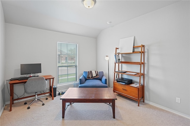 home office with light carpet and lofted ceiling