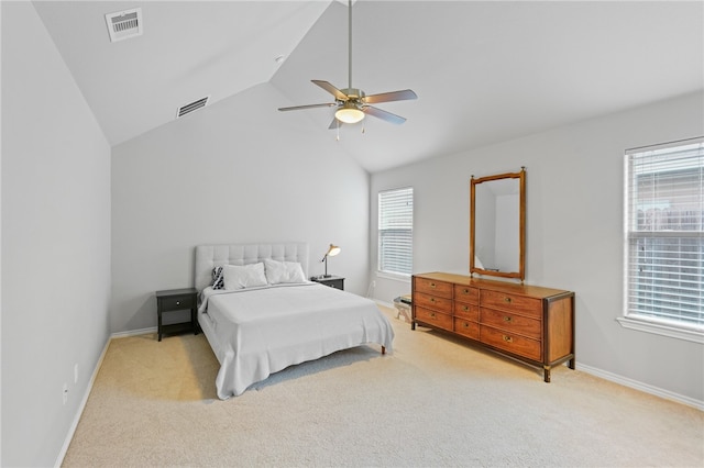 bedroom featuring light carpet, multiple windows, and ceiling fan