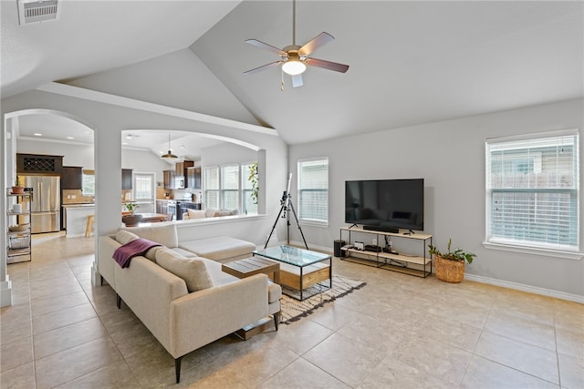 living room with light tile patterned floors, high vaulted ceiling, and ceiling fan