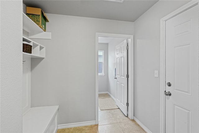 mudroom with light tile patterned floors