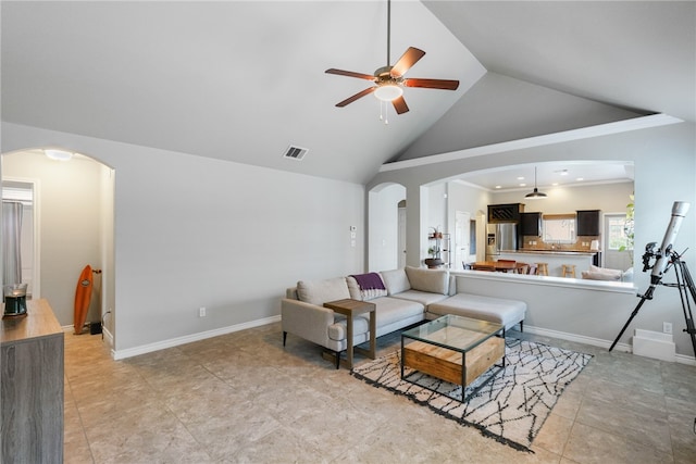 living room with ceiling fan, high vaulted ceiling, and light tile patterned floors