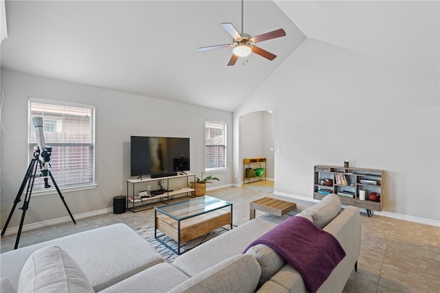 living room featuring ceiling fan, plenty of natural light, and high vaulted ceiling