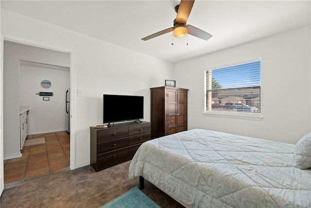 tiled bedroom with ceiling fan and stainless steel fridge