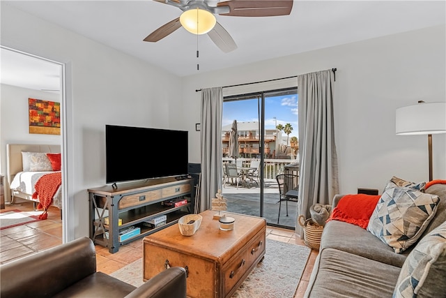 living room featuring light tile patterned flooring and ceiling fan