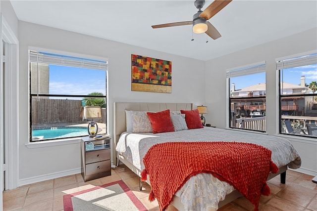 bedroom featuring light tile patterned flooring and ceiling fan