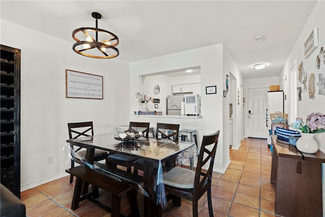 dining area featuring a notable chandelier