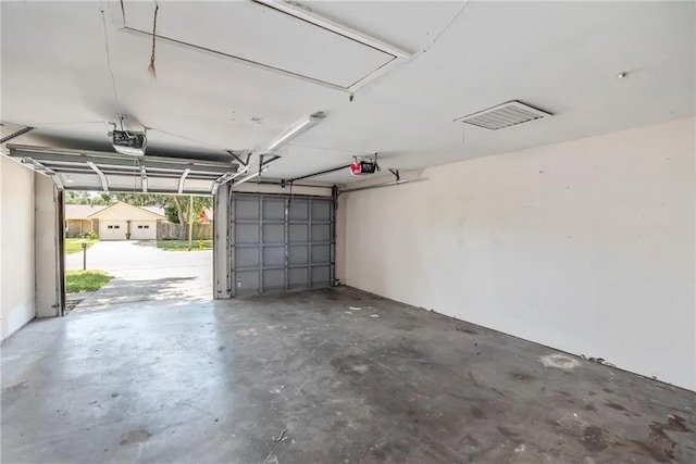 5306 Crestwick Dr, Corpus Christi, TX 78413 - garage featuring a garage door opener