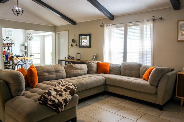 5306 Crestwick Dr, Corpus Christi, TX 78413 - living room featuring light tile patterned floors, healthy amount of natural light, a chandelier, and a textured ceiling