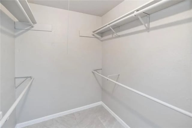 5306 Crestwick Dr, Corpus Christi, TX 78413 - walk in closet with light marble finish flooring