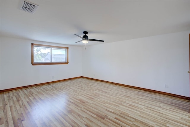 spare room featuring ceiling fan and light hardwood / wood-style floors