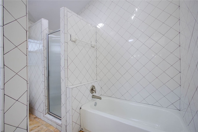 bathroom featuring tile patterned flooring and separate shower and tub