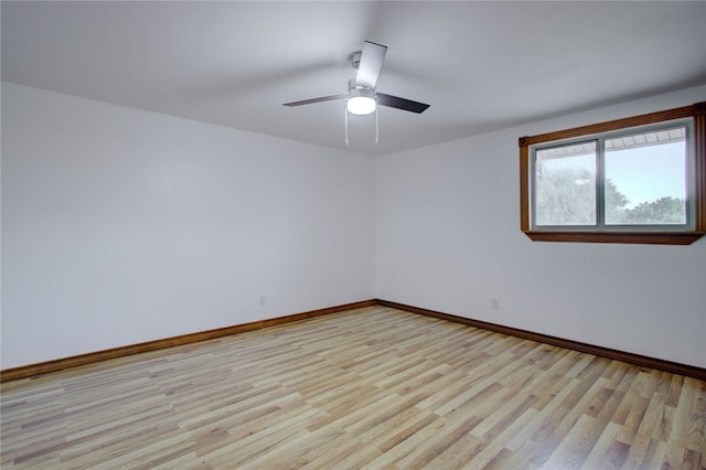 empty room with light hardwood / wood-style floors and ceiling fan