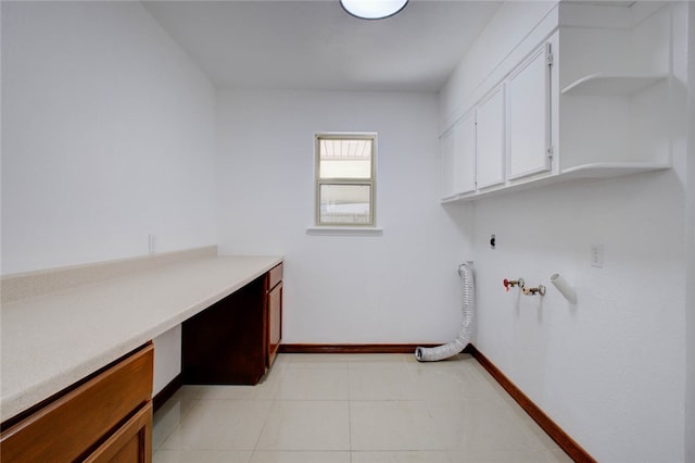 laundry area with hookup for an electric dryer, cabinets, hookup for a gas dryer, washer hookup, and light tile patterned flooring