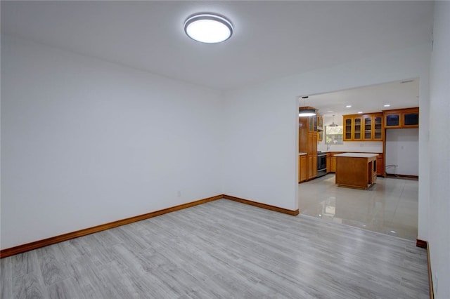 spare room featuring light hardwood / wood-style floors