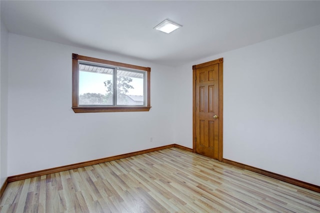 unfurnished room with light hardwood / wood-style flooring