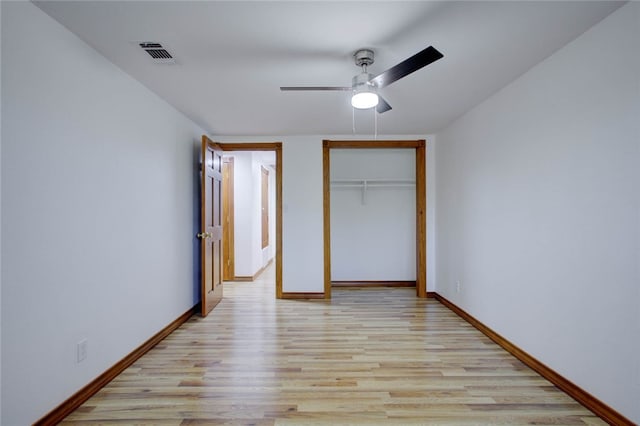 unfurnished bedroom with a closet, ceiling fan, and light hardwood / wood-style flooring