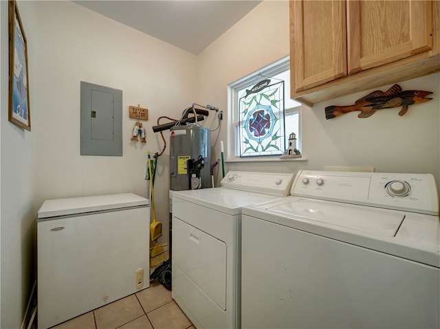 laundry room with electric panel, cabinets, light tile patterned floors, electric water heater, and washer and dryer