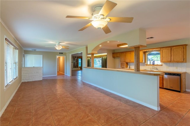 kitchen featuring ceiling fan, dishwasher, light tile patterned floors, and sink