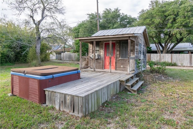 deck with a hot tub and cooling unit