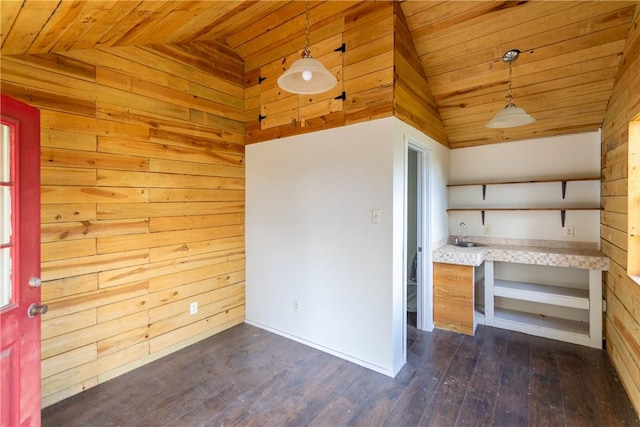 interior space with lofted ceiling, dark wood-type flooring, wooden walls, decorative light fixtures, and wood ceiling