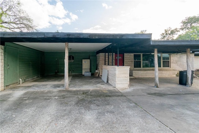 exterior space with a carport