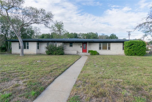 ranch-style home with a front yard