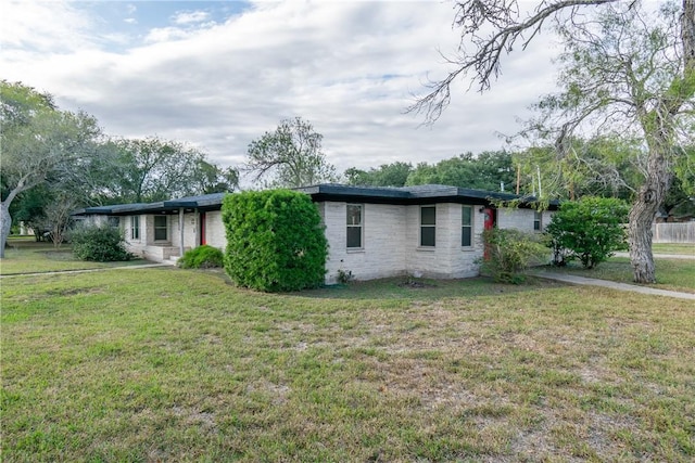 view of side of property with a yard