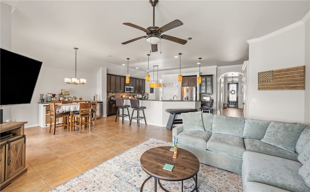 7502 Stampede Dr, Corpus Christi, TX 78414 - living area with ceiling fan, arched walkways, light tile patterned floors, a chandelier, and recessed lighting