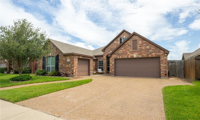 7502 Stampede Dr, Corpus Christi, TX 78414 - view of front of home featuring brick siding, an attached garage, concrete driveway, and a shingled roof