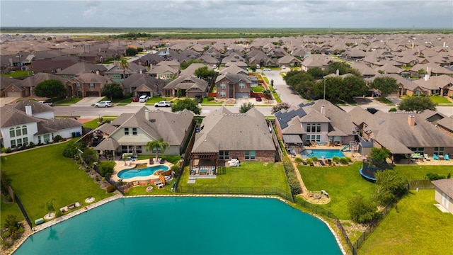 7502 Stampede Dr, Corpus Christi, TX 78414 - aerial view of residential area with a pool and a large body of water