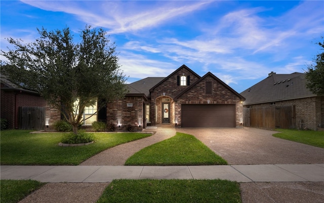 7502 Stampede Dr, Corpus Christi, TX 78414 - french country style house with concrete driveway, brick siding, and a garage