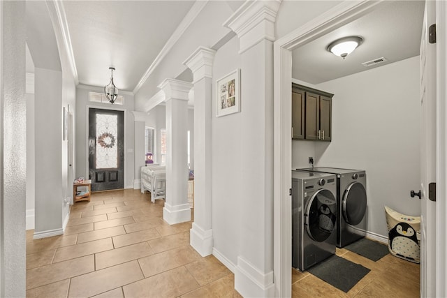 7502 Stampede Dr, Corpus Christi, TX 78414 - laundry room with ornate columns, washer and clothes dryer, light tile patterned flooring, and crown molding