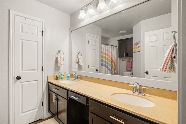 7502 Stampede Dr, Corpus Christi, TX 78414 - bathroom with double vanity and curtained shower
