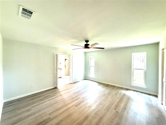 4126 Crenshaw Dr, Corpus Christi, TX 78413 - unfurnished room featuring a ceiling fan, wood finished floors, and a textured ceiling