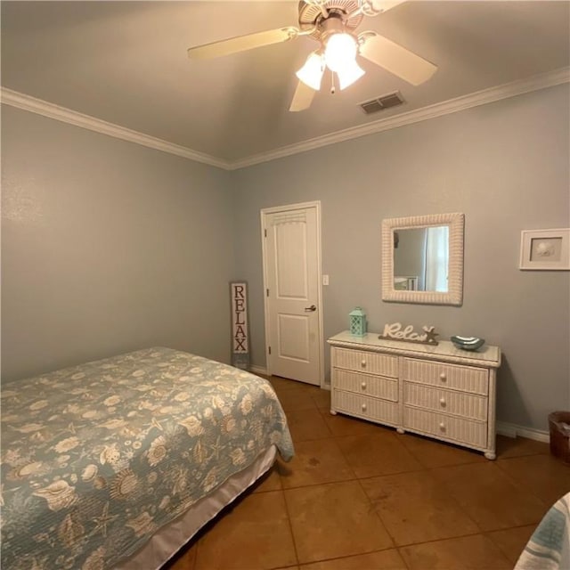 bedroom featuring dark tile patterned flooring, ceiling fan, and crown molding