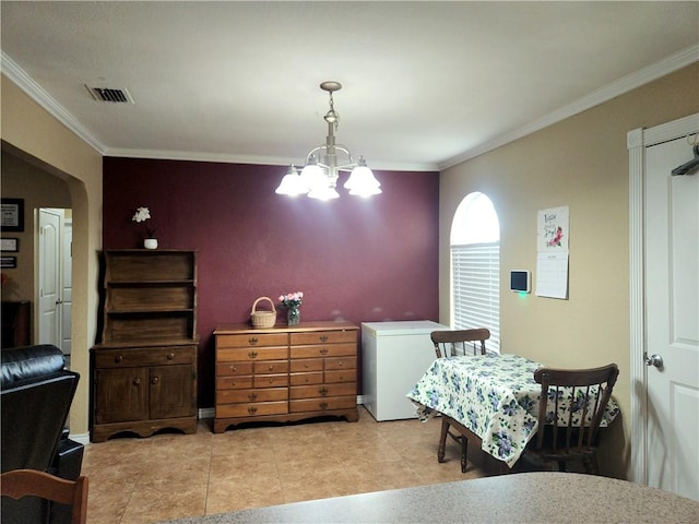 2742 Bramblebush Dr, Corpus Christi, TX 78410 - dining space featuring a chandelier, ornamental molding, and arched walkways