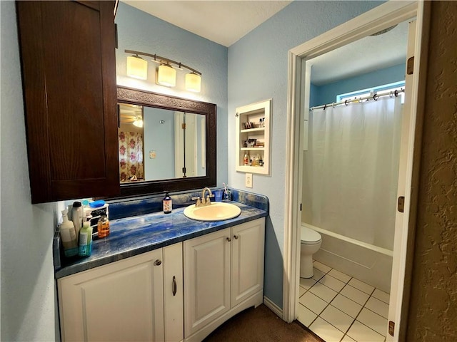 2742 Bramblebush Dr, Corpus Christi, TX 78410 - full bathroom featuring toilet, vanity, tile patterned flooring, a textured wall, and shower / bath combination with curtain