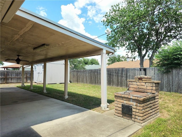 2742 Bramblebush Dr, Corpus Christi, TX 78410 - view of patio / terrace with a shed, an outbuilding, and a ceiling fan