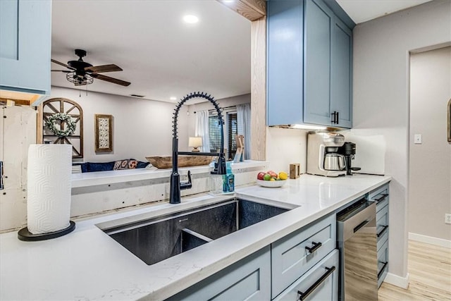 kitchen featuring light wood-style flooring, recessed lighting, a sink, a ceiling fan, and dishwasher