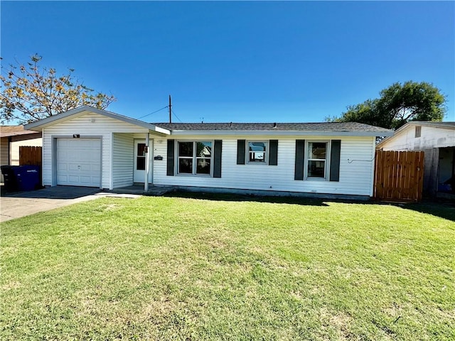 ranch-style house featuring a garage and a front yard