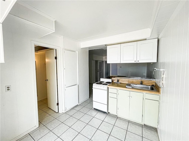 14300 S Padre Island Dr Unit 184, Corpus Christi, TX 78418 - kitchen with white range with electric stovetop, white cabinetry, a sink, and light tile patterned floors