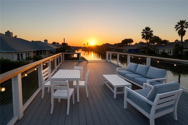 14154 Cutlass Ave, Corpus Christi, TX 78418 - deck at dusk featuring an outdoor hangout area, a water view, and a residential view