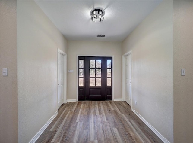 foyer with hardwood / wood-style floors