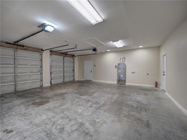 garage with electric water heater and a garage door opener