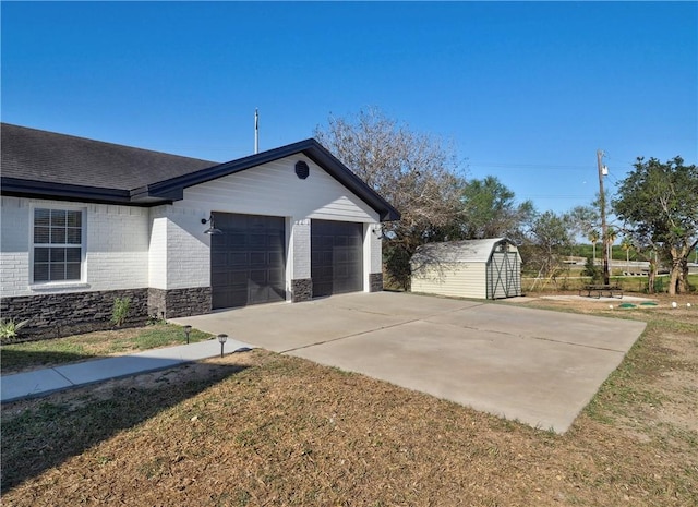 view of home's exterior featuring a lawn, a shed, and a garage