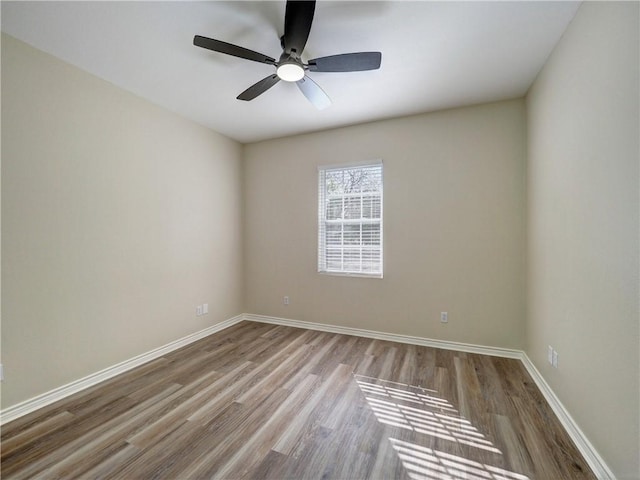 spare room featuring ceiling fan and light wood-type flooring