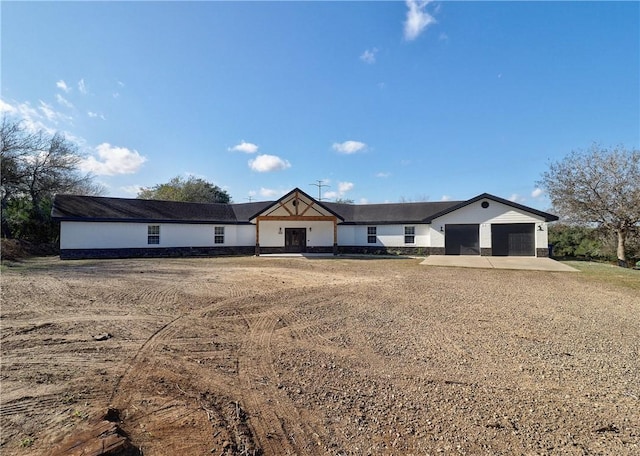 ranch-style house featuring a garage