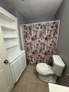 bathroom with curtained shower, toilet, and tile patterned floors