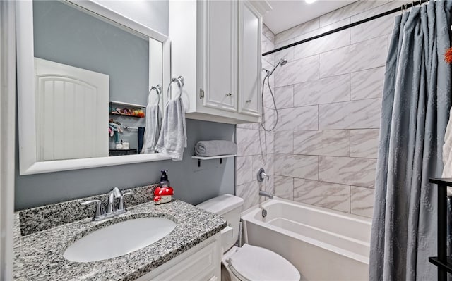 full bathroom featuring toilet, shower / bath combo, and vanity